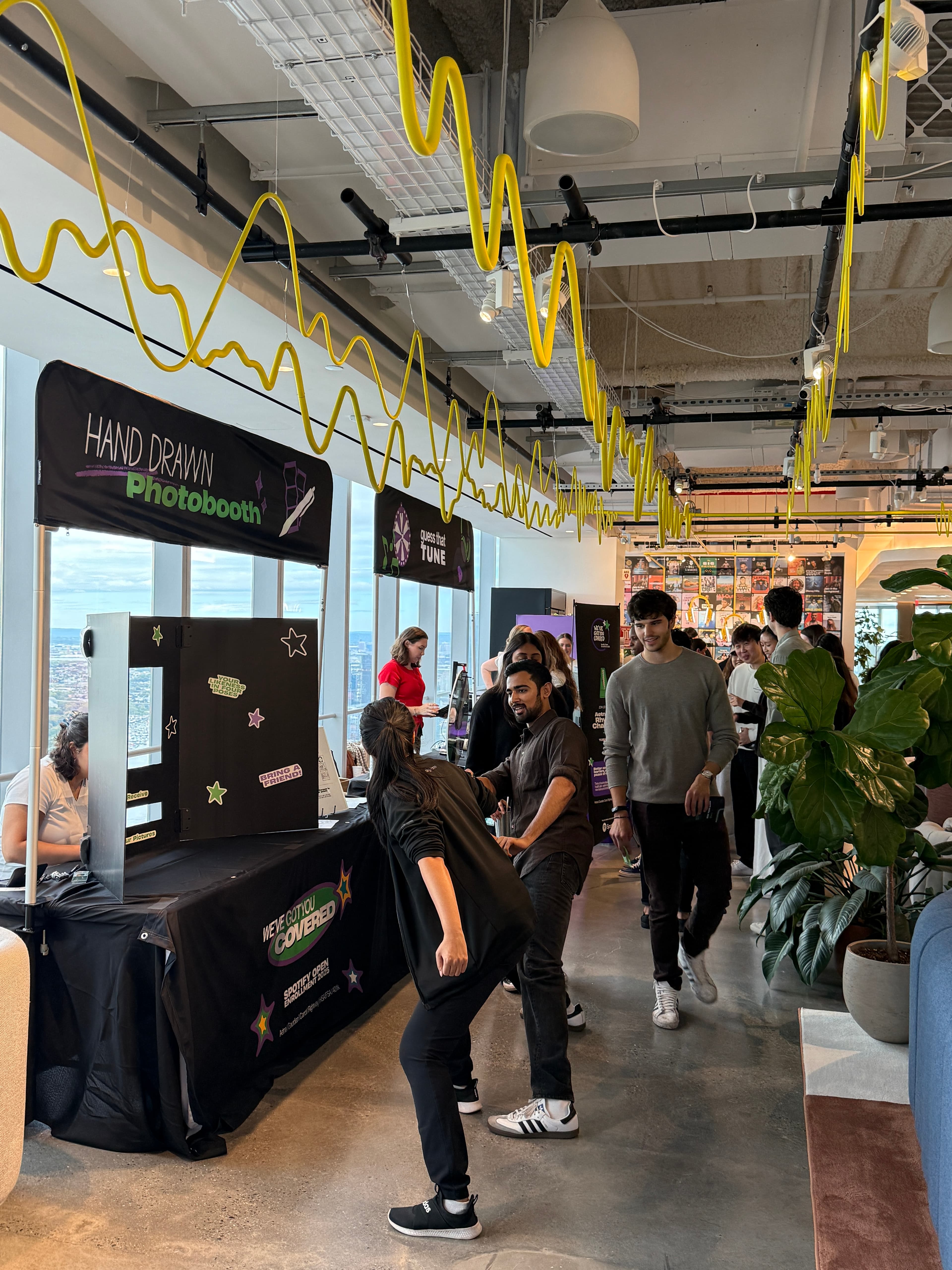 Employees enjoying interactive activities at a corporate wellness event